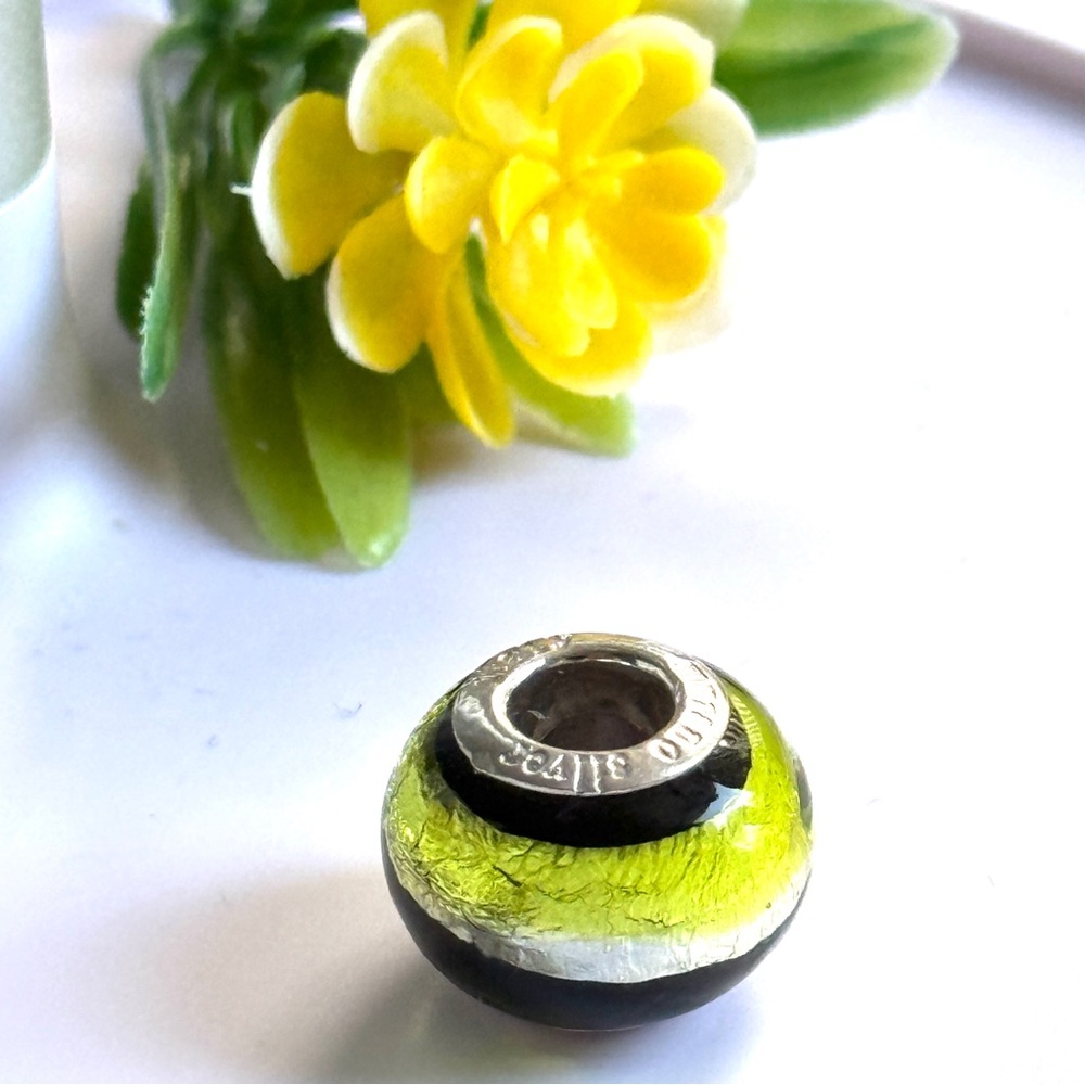 Murano Glass Charm With 925 Silver Core.
Lime Green and Black